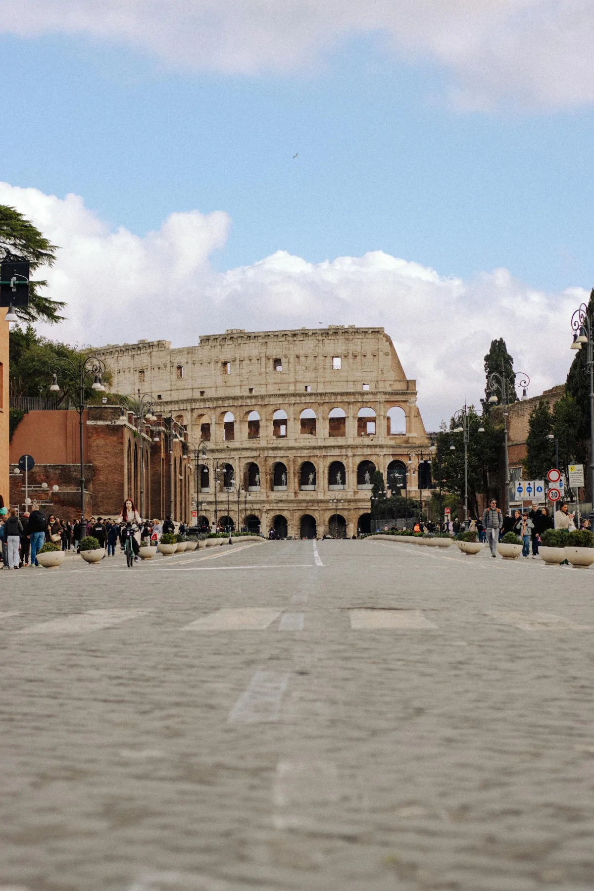 Travellers exploring the Colosseum area in Rome
